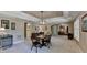 Finished basement includes a dining table, a wine cooler, and view of the living room at 955 Bishopswood Pl, Johns Creek, GA 30022