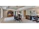 Open basement includes a dining table, a bookcase, and a view of the backyard at 955 Bishopswood Pl, Johns Creek, GA 30022
