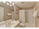 Cozy bathroom features a vanity with sink, toilet, and shower-tub combo at 955 Bishopswood Pl, Johns Creek, GA 30022