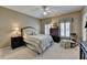 Comfortable bedroom with plush carpeting, neutral walls, and an elegant bed frame at 955 Bishopswood Pl, Johns Creek, GA 30022