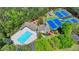 Overhead view of community pool and tennis courts with meticulously maintained facilities at 955 Bishopswood Pl, Johns Creek, GA 30022