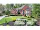 Beautiful brick home boasting meticulous landscaping and a charming, traditional facade at 955 Bishopswood Pl, Johns Creek, GA 30022
