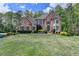 Stunning brick home with a perfectly landscaped yard, offering classic curb appeal at 955 Bishopswood Pl, Johns Creek, GA 30022