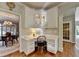 Cozy home office nook featuring custom white cabinetry and a built-in desk area at 955 Bishopswood Pl, Johns Creek, GA 30022