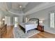 Large main bedroom with hardwood floors and a spacious ensuite bathroom at 955 Bishopswood Pl, Johns Creek, GA 30022