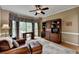 Inviting home office featuring custom built-ins, work desk, and a large window at 955 Bishopswood Pl, Johns Creek, GA 30022