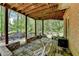 Outdoor patio area with table and chairs, perfect for relaxing and enjoying nature at 955 Bishopswood Pl, Johns Creek, GA 30022
