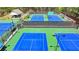 Community tennis courts with multiple courts for friendly matches and recreational play at 955 Bishopswood Pl, Johns Creek, GA 30022