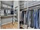Well-organized walk-in closet with ample shelving, hanging rods, and a full-length mirror at 955 Bishopswood Pl, Johns Creek, GA 30022