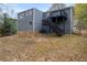 The backyard features a deck with stairs leading to the ground, offering outdoor living and relaxation at 175 Montego Cir, Riverdale, GA 30274