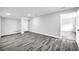 Finished basement with plank flooring, neutral walls, and ample room for entertainment or relaxation at 175 Montego Cir, Riverdale, GA 30274