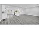 Basement featuring an open layout, kitchen, gray flooring, and natural light at 175 Montego Cir, Riverdale, GA 30274