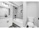 Bathroom showcasing tiled shower and tub, with new fixtures and vanity at 175 Montego Cir, Riverdale, GA 30274