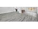 Open concept kitchen featuring modern appliances, an island, and new flooring at 175 Montego Cir, Riverdale, GA 30274