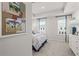Bright bedroom featuring large windows, neutral walls, and tasteful decor at 522 Provence Gate Ln, Lawrenceville, GA 30044