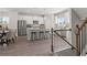 Bright eat-in kitchen boasts stainless steel appliances, a center island with seating, and hardwood style flooring at 522 Provence Gate Ln, Lawrenceville, GA 30044