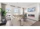 Bright living room with modern fireplace and large windows at 522 Provence Gate Ln, Lawrenceville, GA 30044