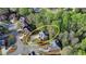 Overhead view of home featuring large driveway and surrounding neighborhood at 5717 Harmony Point Dr, Lilburn, GA 30047
