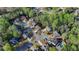 Neighborhood aerial view of homes surrounded by mature trees at 5717 Harmony Point Dr, Lilburn, GA 30047