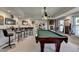 Finished basement with a pool table, dart board, and bar area at 5717 Harmony Point Dr, Lilburn, GA 30047