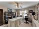 Bright bedroom with a ceiling fan, desk, and custom storage at 5717 Harmony Point Dr, Lilburn, GA 30047
