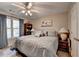 Bedroom with a ceiling fan, large window, and natural light at 5717 Harmony Point Dr, Lilburn, GA 30047