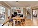 Dining room with natural light, stairs, and open concept living space at 5717 Harmony Point Dr, Lilburn, GA 30047