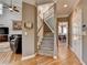 Hallway with staircase and open concept living space at 5717 Harmony Point Dr, Lilburn, GA 30047
