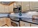 Close up view of kitchen featuring stainless oven and microwave at 5717 Harmony Point Dr, Lilburn, GA 30047