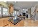 Open concept kitchen features island, modern appliances, and seamless flow to dining area at 5717 Harmony Point Dr, Lilburn, GA 30047