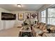 Comfortable living room with sports decor, plush sofas, and natural light at 5717 Harmony Point Dr, Lilburn, GA 30047