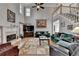 Grand living room featuring hardwood floors, a fireplace, and ample seating space at 5717 Harmony Point Dr, Lilburn, GA 30047