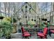 Outdoor deck featuring iron pergola, potted plants, and outdoor furniture at 5717 Harmony Point Dr, Lilburn, GA 30047