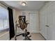 Compact workout room with exercise equipment, a window, and a closet at 5717 Harmony Point Dr, Lilburn, GA 30047
