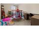 Bright bedroom with playful décor, small trampoline, desk, and natural light at 6389 Shadow Sq, Lithonia, GA 30058