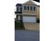 Charming two-story home with a two-car garage, manicured lawn, and classic design at 6389 Shadow Sq, Lithonia, GA 30058