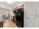 Efficient kitchen with ample cabinet space, appliances, and an adjacent dining area at 6389 Shadow Sq, Lithonia, GA 30058