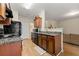 Bright kitchen featuring granite countertops, wood cabinets, and stainless steel appliances at 6389 Shadow Sq, Lithonia, GA 30058
