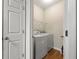 Convenient laundry room with modern washer and dryer units and ample storage space at 6389 Shadow Sq, Lithonia, GA 30058