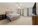 Spacious primary bedroom featuring a ceiling fan, and neutral decor at 6389 Shadow Sq, Lithonia, GA 30058
