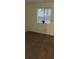 Bedroom showcasing a window with blinds and neutral carpeting at 849 Cadet Nw Ct, Lilburn, GA 30047