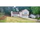 Charming two-story home with a well-maintained lawn and a convenient two-car garage at 849 Cadet Nw Ct, Lilburn, GA 30047