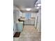 Bright kitchen with white cabinetry, stainless appliances, and tile flooring at 849 Cadet Nw Ct, Lilburn, GA 30047
