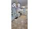 Bright kitchen with white cabinetry, stainless appliances, and tile flooring at 849 Cadet Nw Ct, Lilburn, GA 30047