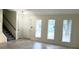 Spacious living room with tile floors, neutral walls, and natural light at 849 Cadet Nw Ct, Lilburn, GA 30047