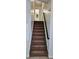 Carpeted stairs leading to the upper level of the home at 849 Cadet Nw Ct, Lilburn, GA 30047