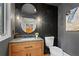 Modern bathroom featuring a unique mirror, stylish vanity, and contemporary fixtures at 1890 Spalding Dr, Atlanta, GA 30350
