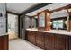 Elegant bathroom features a double sink vanity with dark wood cabinets and marble countertops at 1890 Spalding Dr, Atlanta, GA 30350