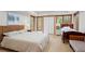 Bright bedroom with hardwood floors, two beds and view of trees at 1890 Spalding Dr, Atlanta, GA 30350