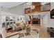 Open-concept living area features a fireplace, hardwood floors, and natural light at 1890 Spalding Dr, Atlanta, GA 30350